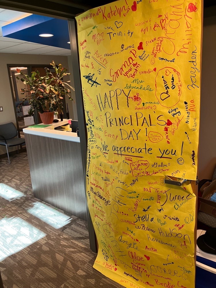 The giant door card signed by students and staff.